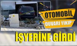 Otomobil duvarı yıkıp işyerine girdi