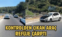 Kontrolden çıkan araç refüje çarptı