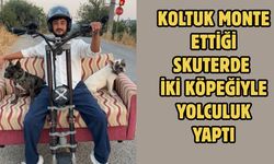 Koltuk monte ettiği skuterde iki köpeğiyle yolculuk yaptı
