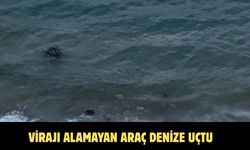 Virajı alamayan araç denize uçtu