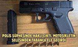 Polis şüphesinde haklı çıktı, motosikletin selesinden tabanca ele geçirdi
