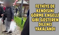 Fethiye'de kendisini görme engelli gibi gösteren dilenci yakalandı