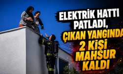 Elektrik hattı patladı, çıkan yangında 2 kişi mahsur kaldı