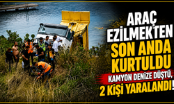 Araç ezilmekten son anda kurtuldu Kamyon denize düştü, 2 kişi yaralandı