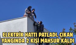 Elektrik hattı patladı, çıkan yangında 2 kişi mahsur kaldı