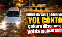Muğla'da yağış nedeniyle yol çöktü, çukura düşen araç yolda mahsur kaldı
