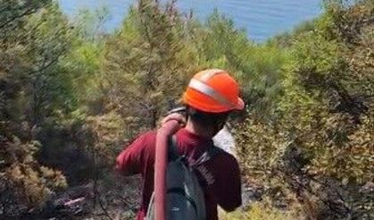 Marmaris'te yangın bölgesinde yeniden alevlenmelere karşı yoğun mesai