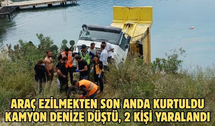 Araç ezilmekten son anda kurtuldu Kamyon denize düştü, 2 kişi yaralandı