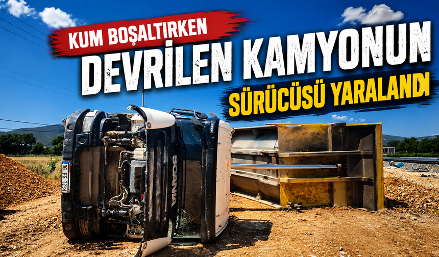 Kum boşaltırken devrilen kamyonun sürücüsü yaralandı